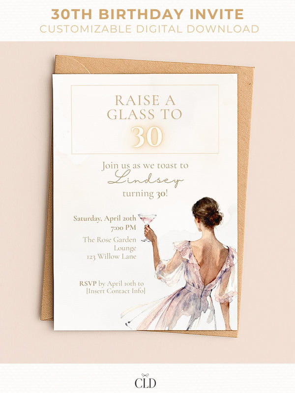 Elegant “30th Birthday Invite” mockup featuring a watercolor illustration of a woman in a soft mauve and cream dress holding a cocktail glass. The text reads “Raise a glass to 30 – Join us as we toast to Lindsey turning 30!” with event details below in gold and taupe typography. The invitation is placed on a neutral envelope against a beige background with CLD branding at the bottom.