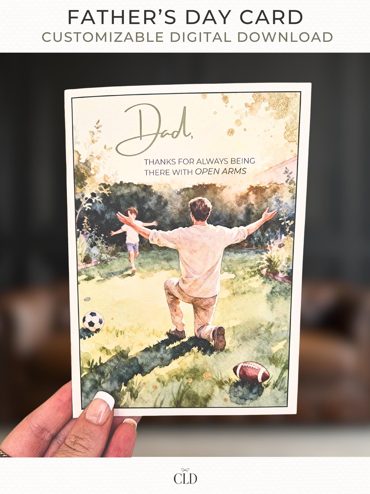 Hand holding a printed Father’s Day card with a watercolor illustration of a father kneeling in a sunlit garden with open arms as a child runs toward him. Soft golden tones and green landscape elements surround the scene. Text on the card reads: ‘Dad, thanks for always being there with open arms.’ Modern, warm, high-end invitation mockup by CLD