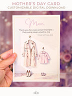 Hand holding a soft watercolor Mother’s Day card featuring a beige trench coat and a pink children’s coat with matching shoes, elegant script reading ‘Mom,’ and a warm, blurred pink floral background. Modern, feminine, high-end card mockup with CLD branding.