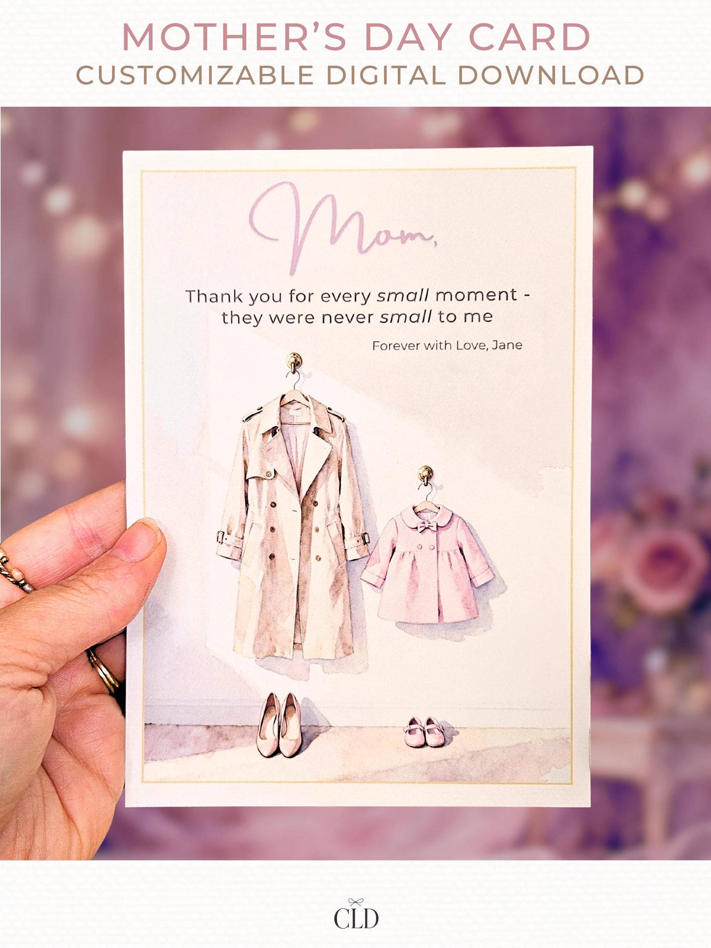 Hand holding a soft watercolor Mother’s Day card featuring a beige trench coat and a pink children’s coat with matching shoes, elegant script reading ‘Mom,’ and a warm, blurred pink floral background. Modern, feminine, high-end card mockup with CLD branding.