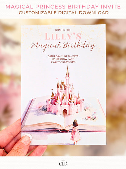 Close-up photo of a hand holding a printed fairytale-style princess birthday invitation featuring a pink castle rising from an open storybook, soft blush tones, and watercolor details. Light, magical background with warm tones.
