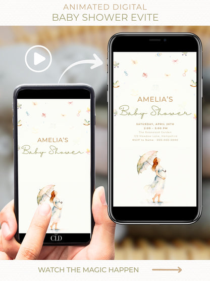 Animated baby shower evite shown on a mobile phone, featuring a soft watercolour illustration of a pregnant woman holding an umbrella, with baby items gently raining down above and elegant neutral text reading “Amelia’s Baby Shower.”
