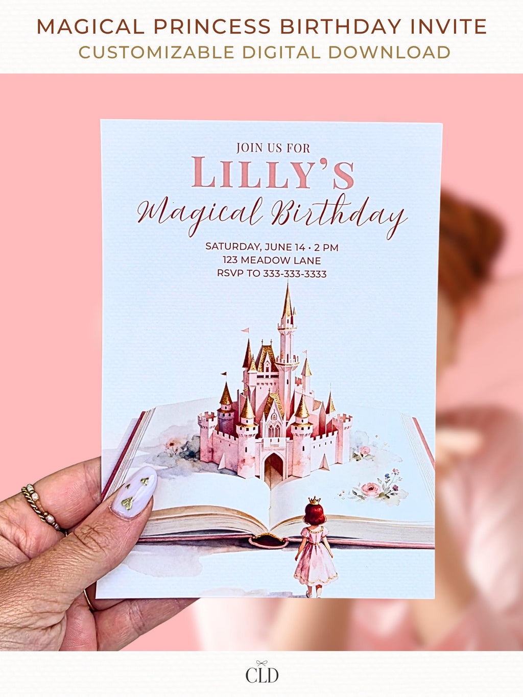 Printable princess birthday invitation held in hand, featuring a storybook castle rising from an open book, soft pink watercolor fairytale design for a girl’s birthday party