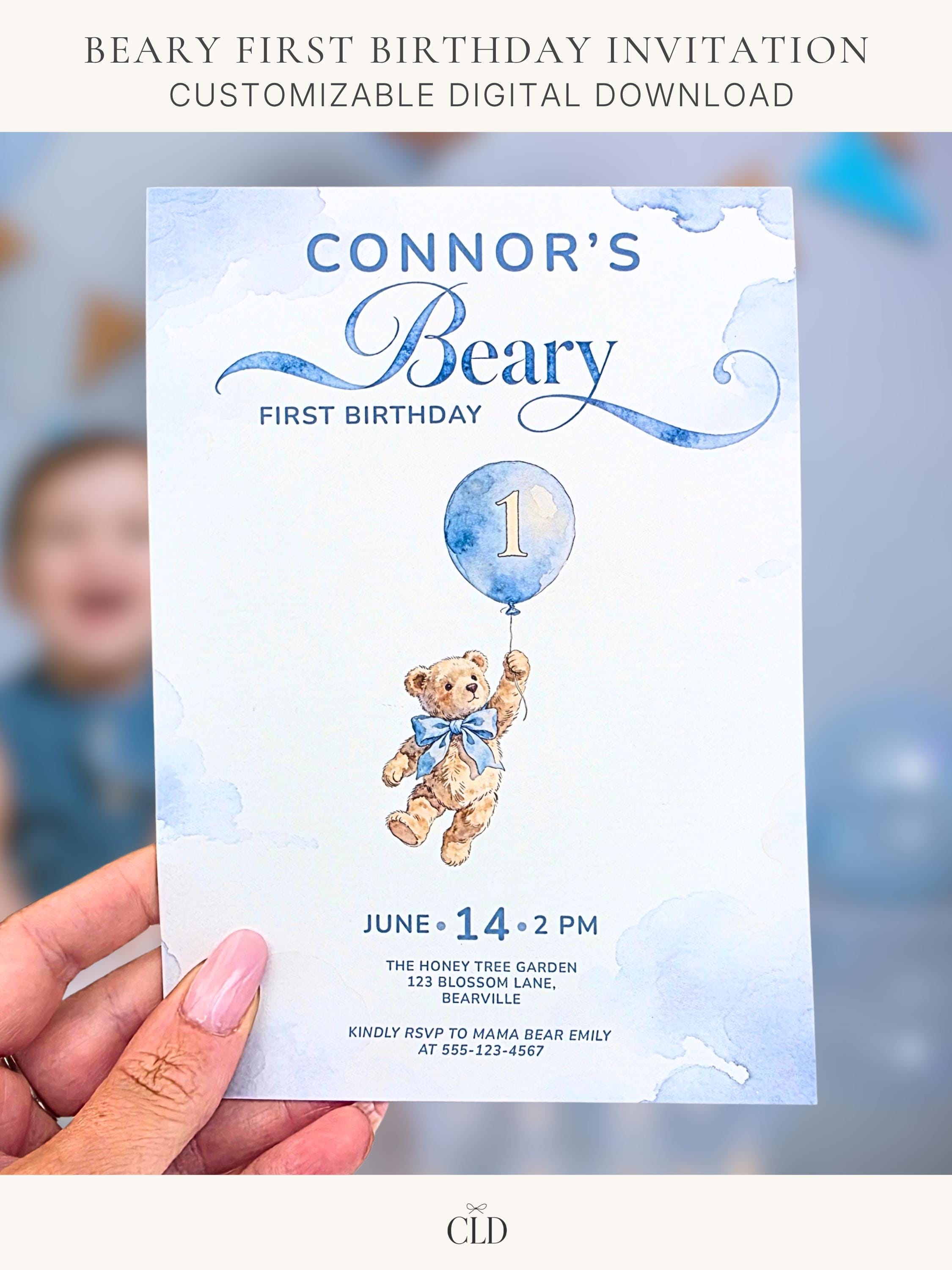 Printable teddy bear first birthday invitation, soft watercolour bear holding a blue balloon with number 1, on a dusty blue cloud background. Editable Canva template, 5x7 size, ready to print at home or send to a print shop.