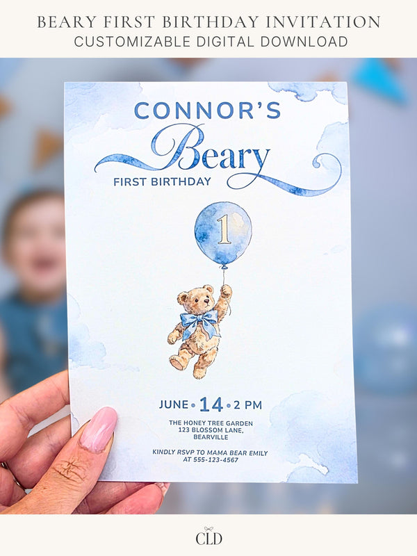 Printable teddy bear first birthday invitation, soft watercolour bear holding a blue balloon with number 1, on a dusty blue cloud background. Editable Canva template, 5x7 size, ready to print at home or send to a print shop.