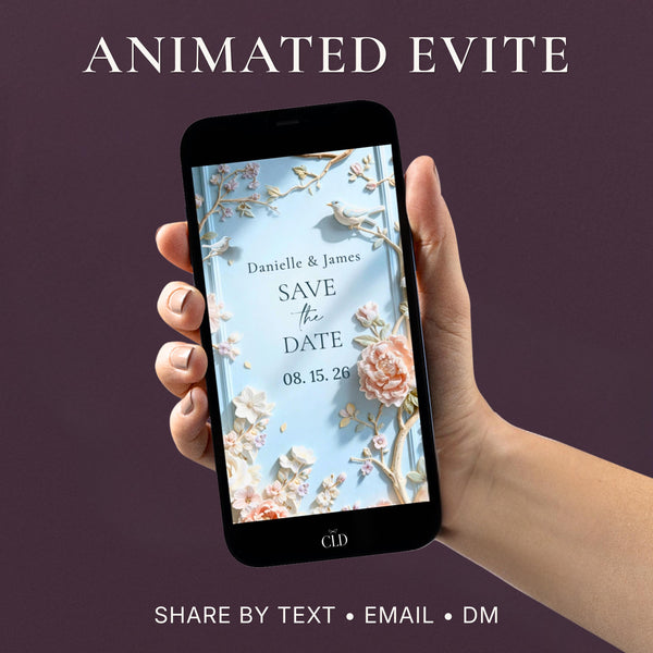 Animated save the date video evite shown on a phone screen, featuring sculpted bas relief florals in powder blue with peonies, cherry blossoms and birds, names and wedding date displayed in soft serif typography, against an aubergine background.