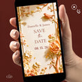 Animated autumn wedding save the date. Sculpted bas-relief florals in blush, peach and terracotta with a terracotta bird and gold leaf accents frame a warm cream centre reading Save the Date, with the names Danielle and James above and the date below. An editable Canva template video to send by text for a fall wedding.